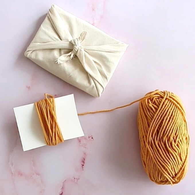 How to Gift Wrap with Yarn Scraps | Hobbycraft